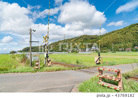 田舎の踏切がある風景の写真素材