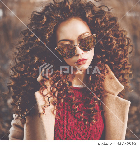 Fashion beautiful lady in autumn landscape 43770065