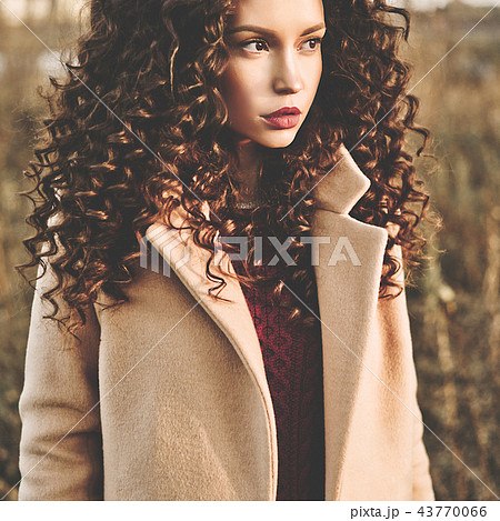 Fashion beautiful lady in autumn landscape 43770066