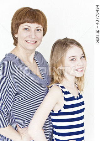 Beautiful mother and daughter on white 43770494