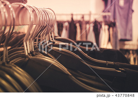 Close up of many clothes on hangers Close up of many clothes on hangers 43770848
