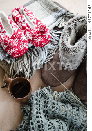 Warm home clothes and cup of hot drink. Warm home clothes and cup of hot drink. 43771562