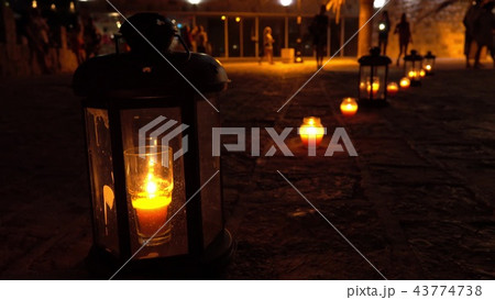 Romantic candle lanterns on the tourist street at night 43774738