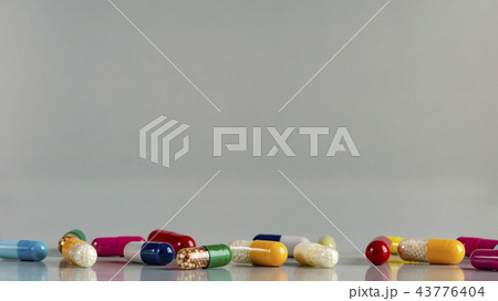 Different medicine capsules and pils 43776404