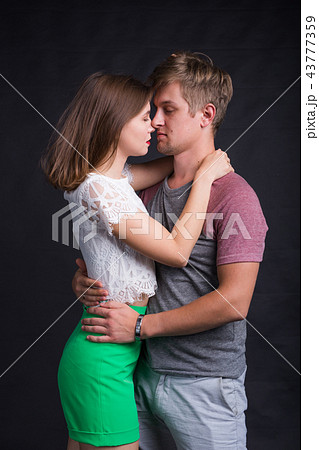 Passionate young people in love on black background 43777359