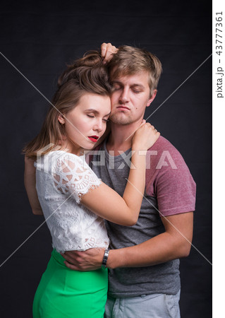 Passionate young people in love on black background 43777361