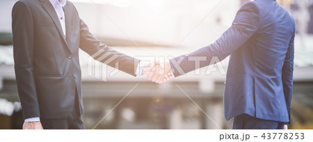 handshake of business People shaking hand in city handshake of business People shaking hand in city 43778253