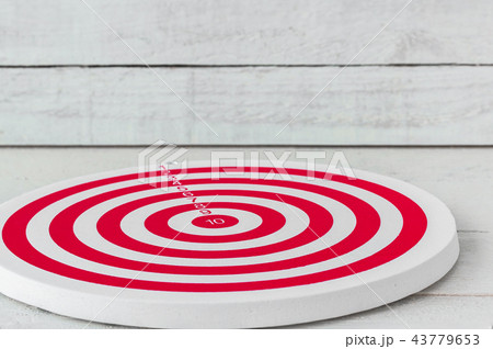 Dartboard on white wood Dartboard on white wood 43779653