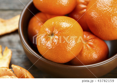 tangerines in a peel in a plate 43782159