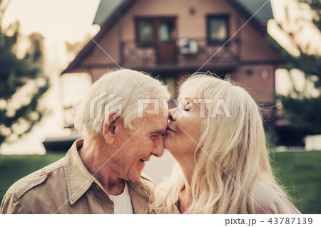 Elderly grey haired woman caressing to man 43787139