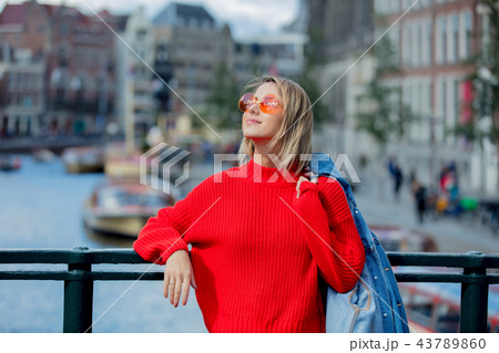 girl in sunglasses at bridge in Amsterdam 43789860