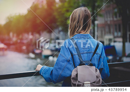 girl with backpack in Amsterdam girl with backpack in Amsterdam 43789954