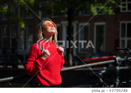 Style girl in sunglasses in Amsterdam Style girl in sunglasses in Amsterdam 43790286