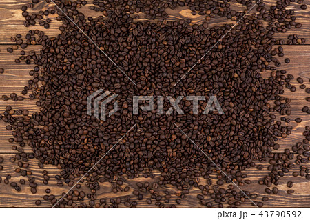 Coffee beans on brown wooden background, coffee texture, top view 43790592