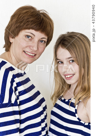 Beautiful mother and daughter on white 43790940