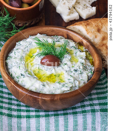 Tzatziki sauce in wooden bowl 43794162