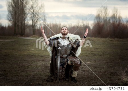 Knight raised his hands to the sky in entreaties. Knight raised his hands to the sky in entreaties. 43794731