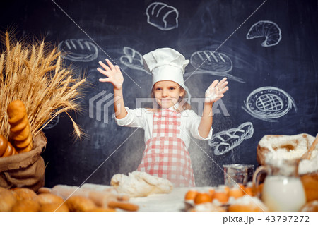 Playful little girl throwing flour powder 43797272