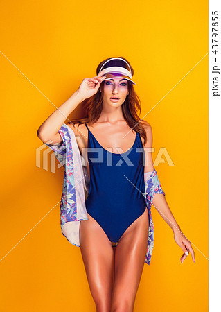 Woman in cap and swimwear 43797856