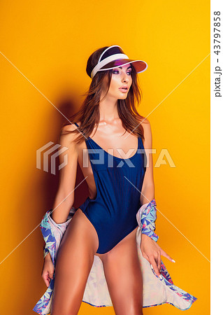Woman in cap and swimwear Woman in cap and swimwear 43797858