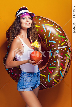Woman in swimsuit with swim ring 43798079