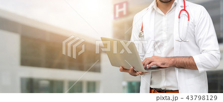 Doctor using laptop computer at the hospital. 43798129
