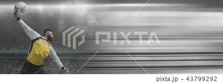 Soccer goalkeeper throwing ball in stadium with transition 43799292