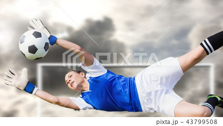 Soccer goalkeeper saving ball in goal 43799508