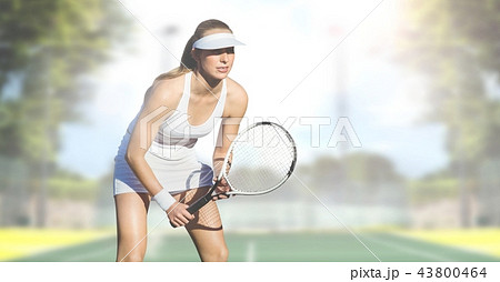 Tennis player woman with bright background with racket 43800464
