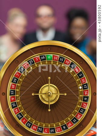 ROulette wheel and people in background ROulette wheel and people in background 43800592