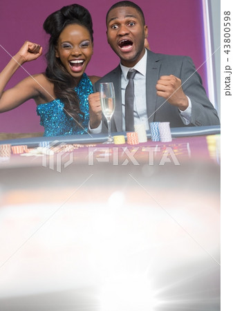 Couple playing in casino 43800598