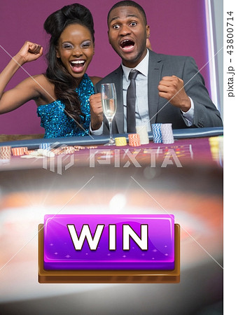 Win button and couple celebrating in casino 43800714