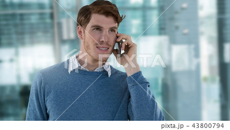 Businessman on phone in modern office 43800794