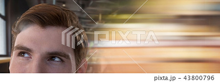 Businessman looking up by window with motion blur 43800796