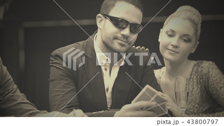 Poker players in casino 43800797