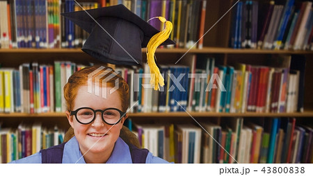 School girl in education library with graduation hat School girl in education library with graduation hat 43800838