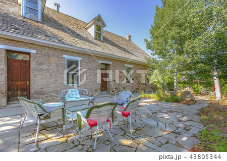 Church outside courtyard with chairs and stone Church outside courtyard with chairs and stone 43805344