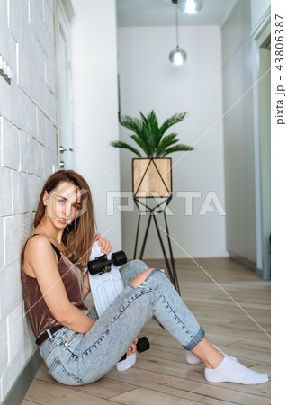 Cute, attractive woman with skateboard 43806387