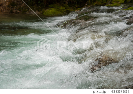 A river of clear water flows fast 43807632