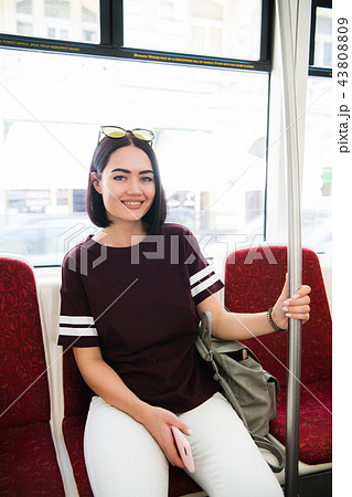 Summer Travel. Portrait Of Happy Smiling Girl In Stylish Sunglasses travelling by bus. Summer Travel. Portrait Of Happy Smiling Girl In Stylish Sunglasses travelling by bus. 43808809