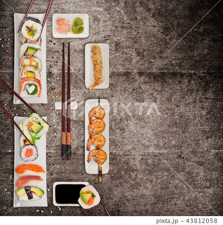 Traditional japanese sushi pieces on rustic concrete background. 43812058