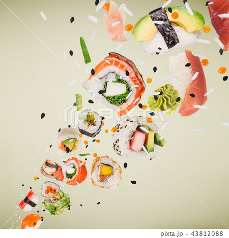 Pieces of delicious japanese sushi frozen in the air. Pieces of delicious japanese sushi frozen in the air. 43812088