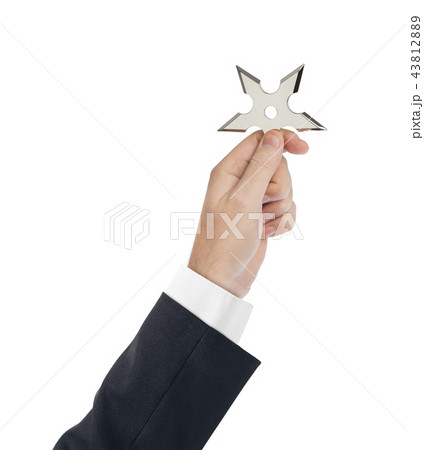Hand is throwing ninja shuriken 43812889