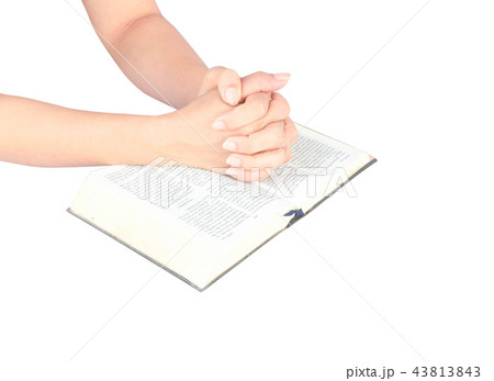 Unrecognizable woman with Bible praying on white 43813843