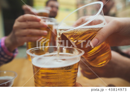 The group of friends enjoying drink at outdoor bar The group of friends enjoying drink at outdoor bar 43814973