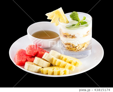Muesli, fresh fruits and honey isolated on black Muesli, fresh fruits and honey isolated on black 43815174