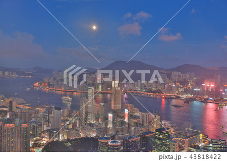 a Skyline of Hong Kong at night with the moon a Skyline of Hong Kong at night with the moon 43818422