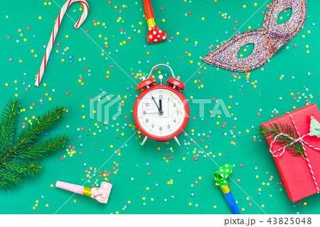 Christmas pattern flat lay with red alarm clock Christmas pattern flat lay with red alarm clock 43825048