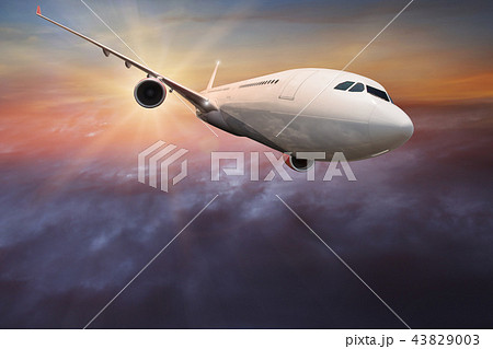 Commercial airplane flying above clouds. Commercial airplane flying above clouds. 43829003