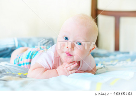 Cheerful baby boy in morning bedroom Child relaxing 43830532